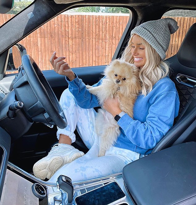 Love Island star Laura Anderson is pictured with her dog, who she is thought to have purchased from Tiffany Puppies