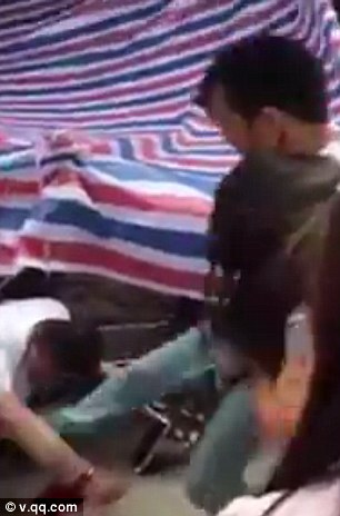 The enraged man grabbed his wife by her top before kicking her alleged lover in the hand